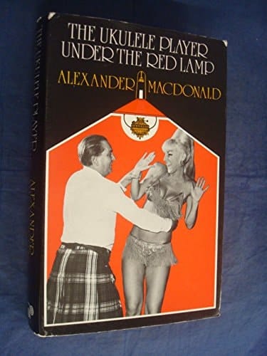 The ukulele player under the red lamp