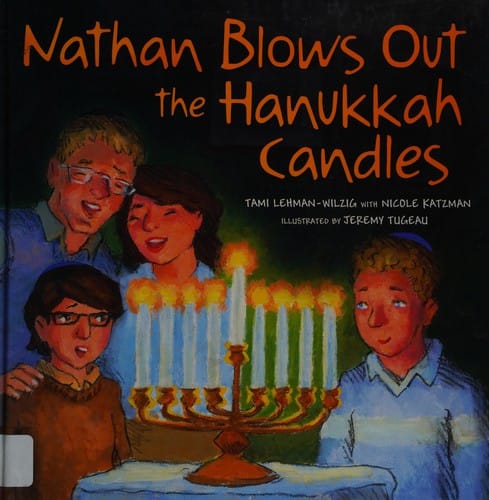 Nathan blows out the Hanukkah candles