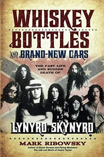 Whiskey bottles and brand-new cars