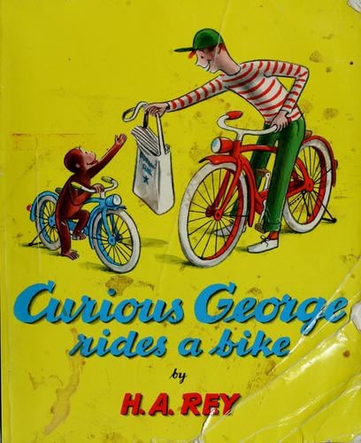 Curious George rides a bike